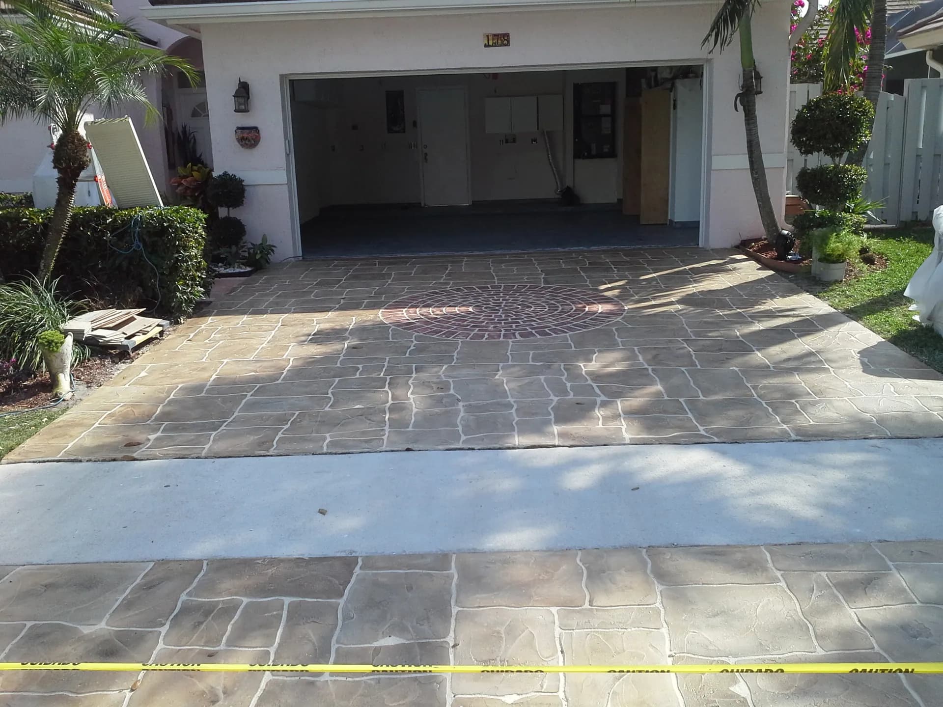 Decorative concrete driveway with stone pattern—a paver-look alternative in South Florida