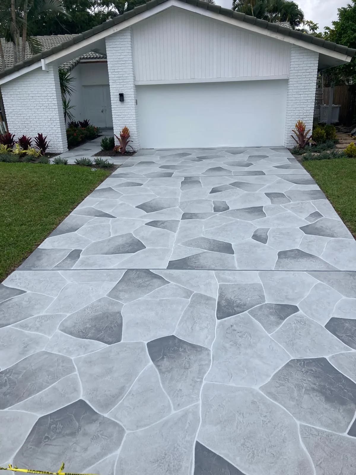 Professional concrete contractor team installing a driveway in Palm Beach County