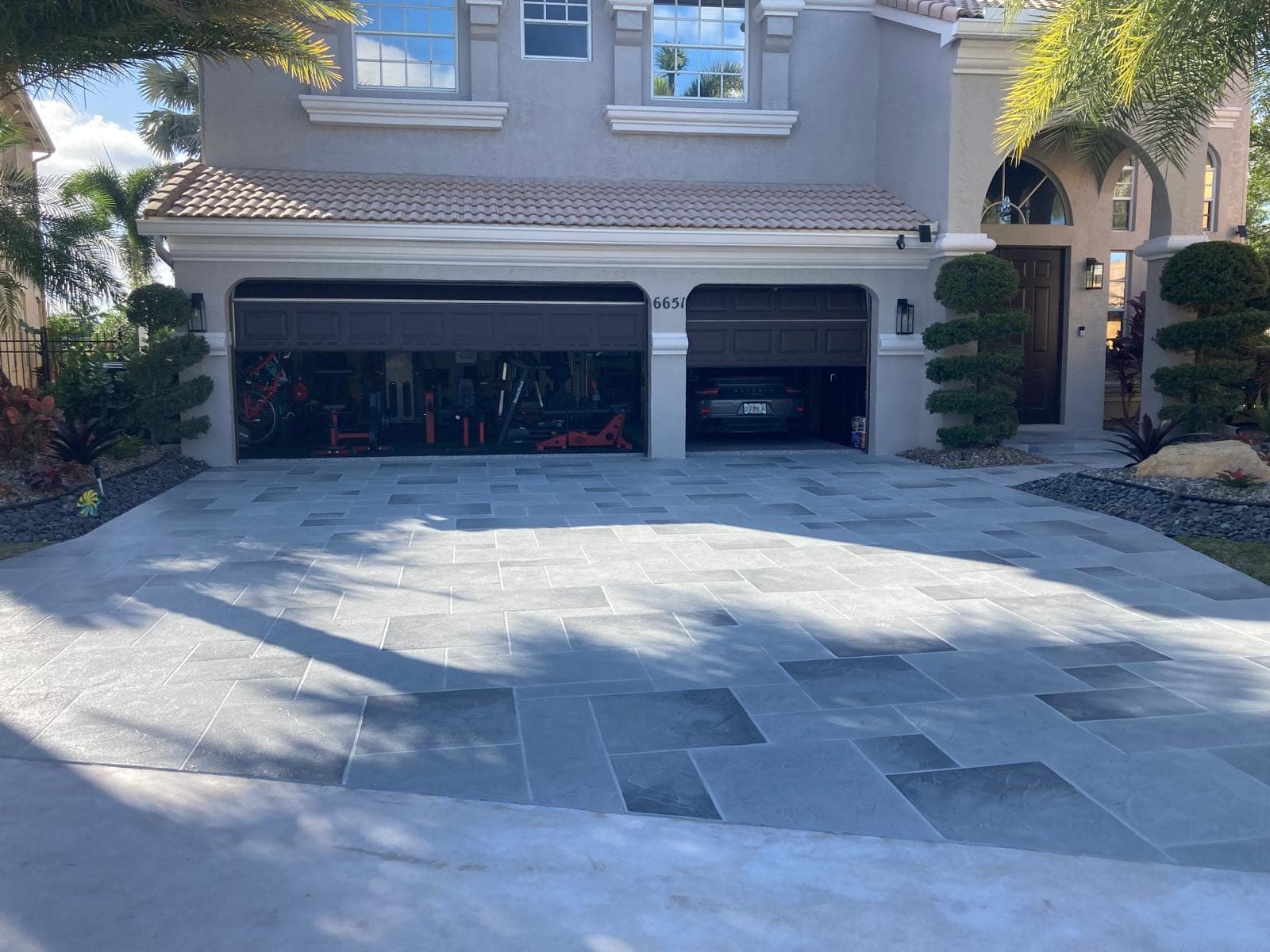 Grey tile pattern stamped mansion driveway