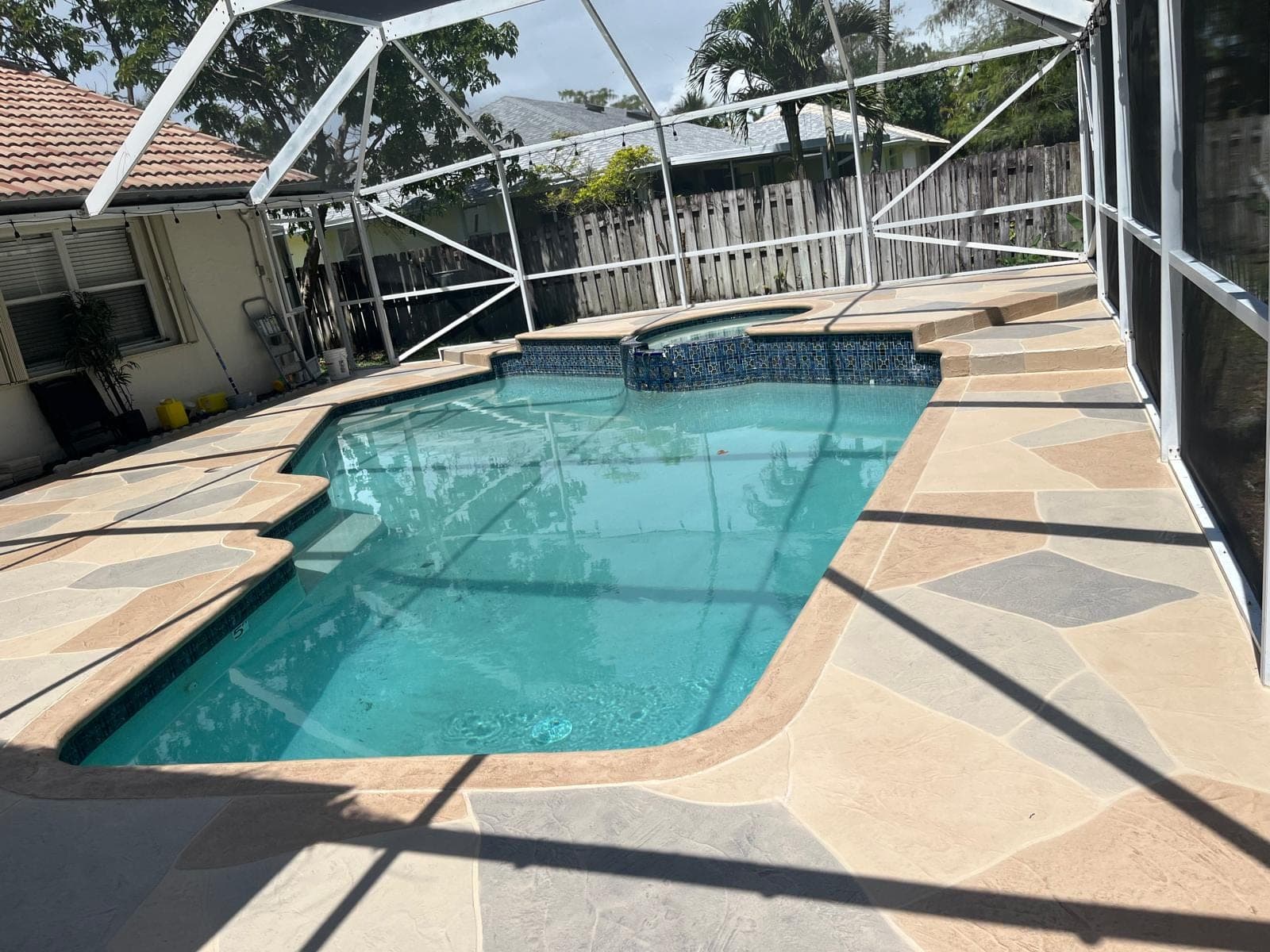 Earth tone overlay pool deck resurfacing