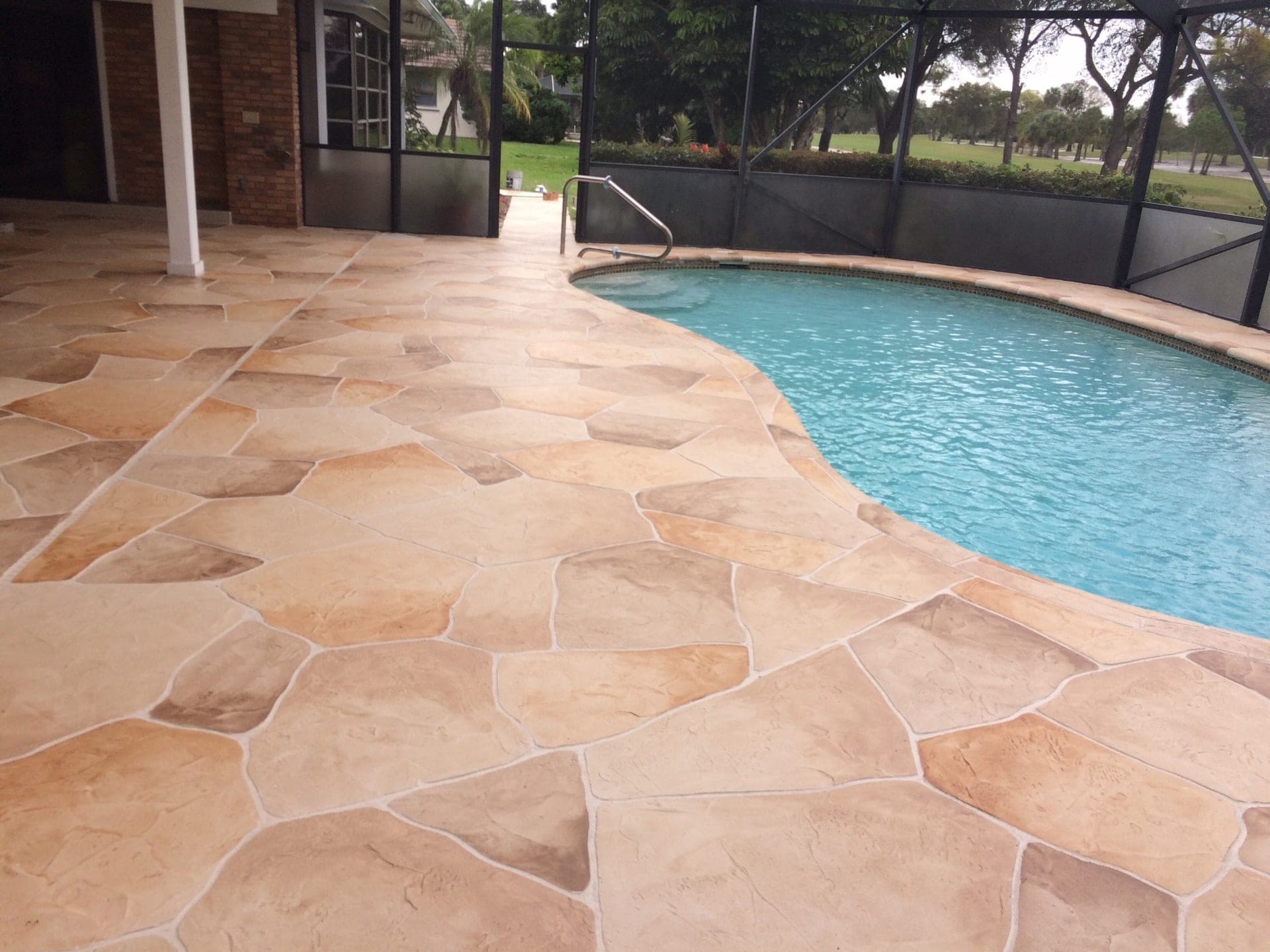 Tan flagstone pool deck resurfacing