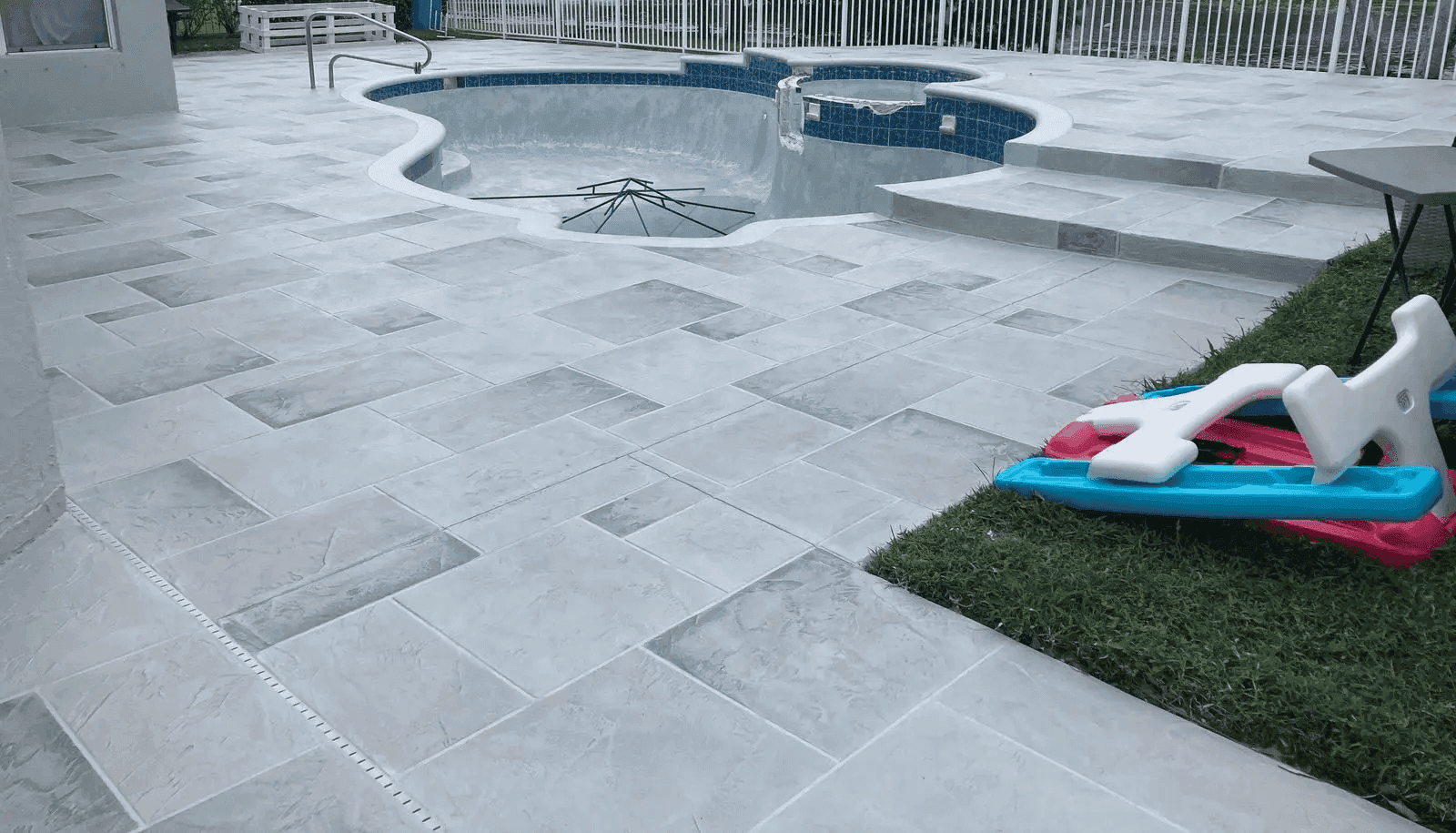 Grey tile pool deck resurface