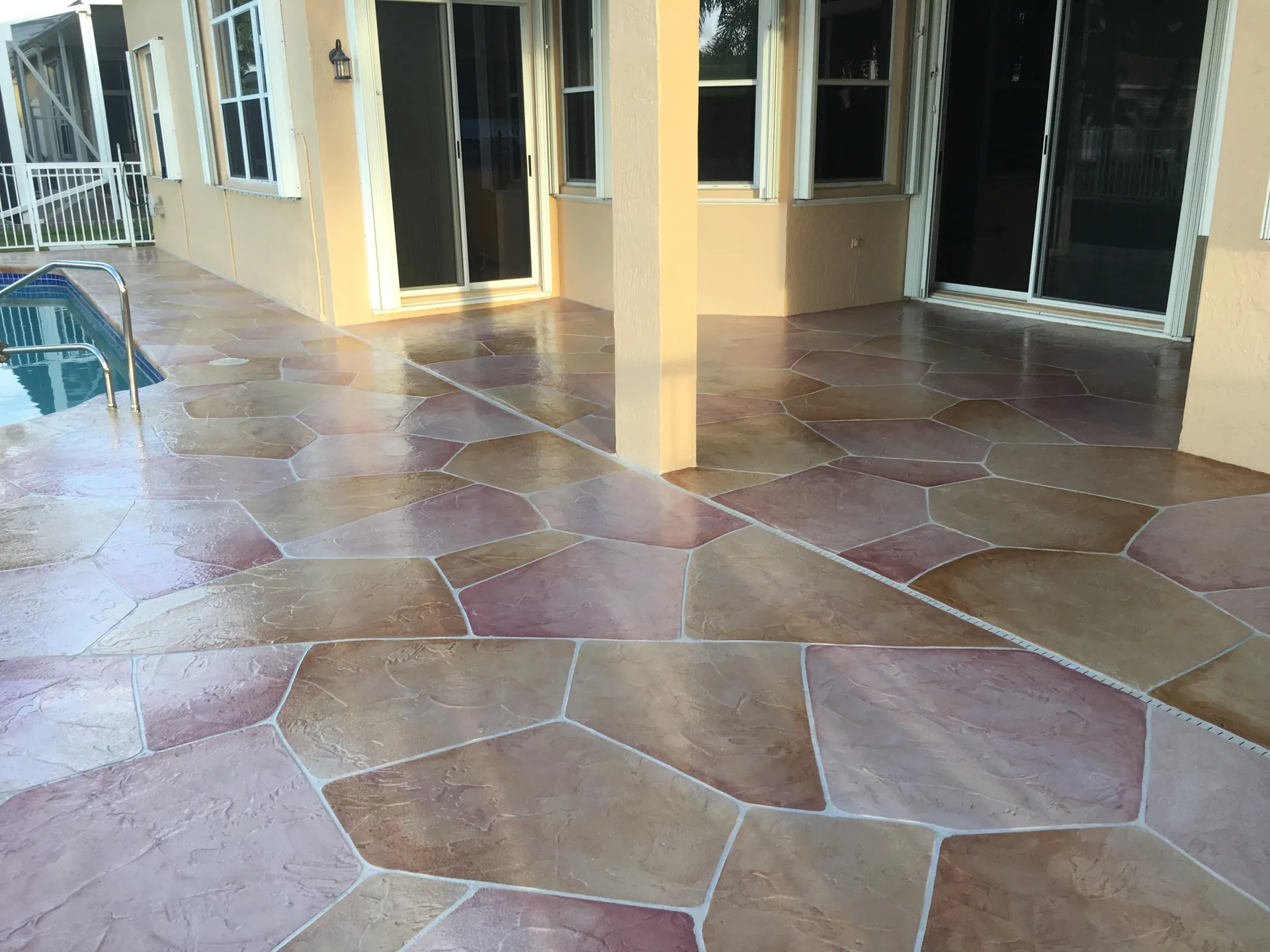Stamped concrete surface showing proper maintenance and sealed color in South Florida