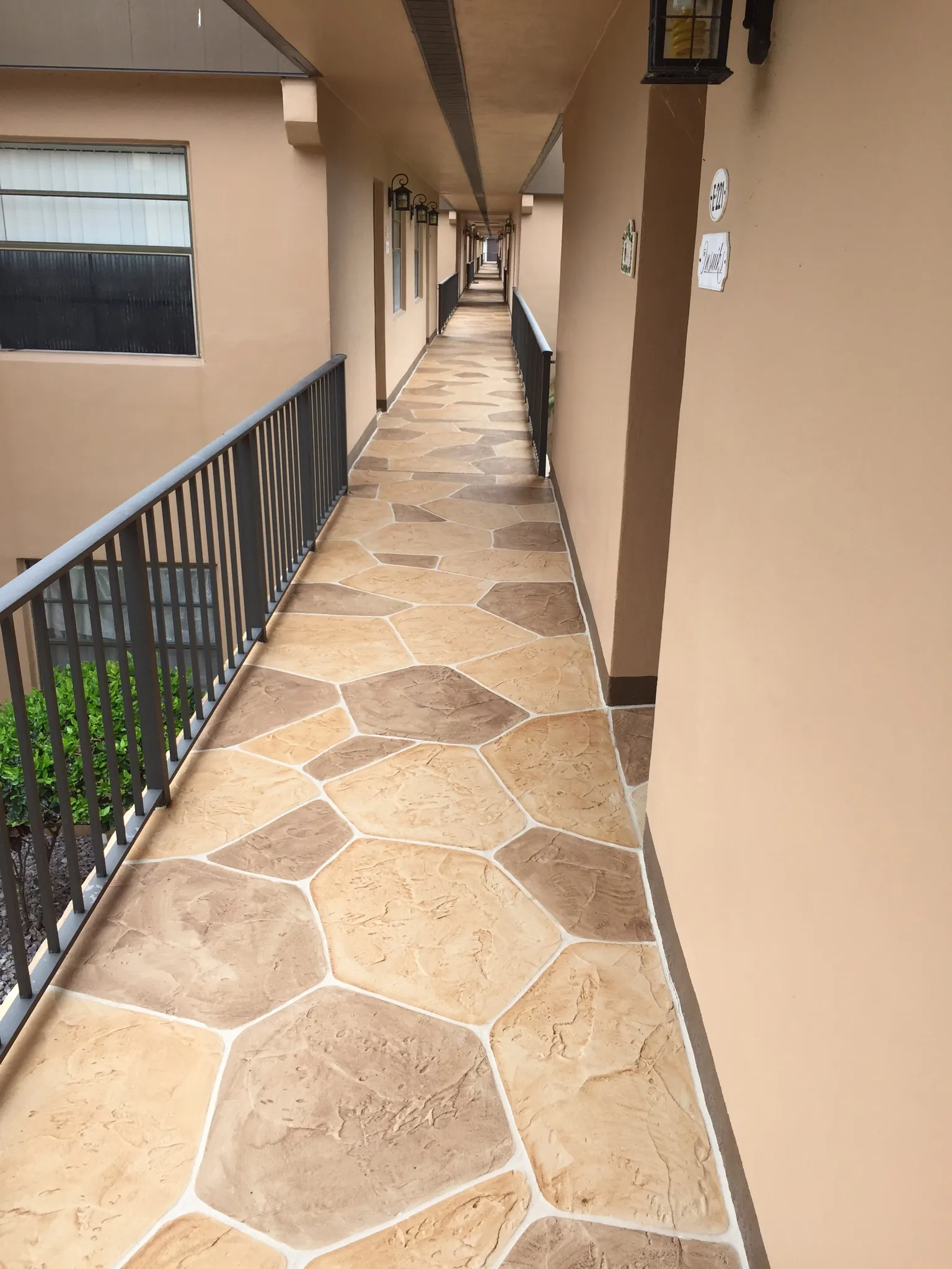 Uneven concrete walkway showing settled sections requiring leveling in South Florida